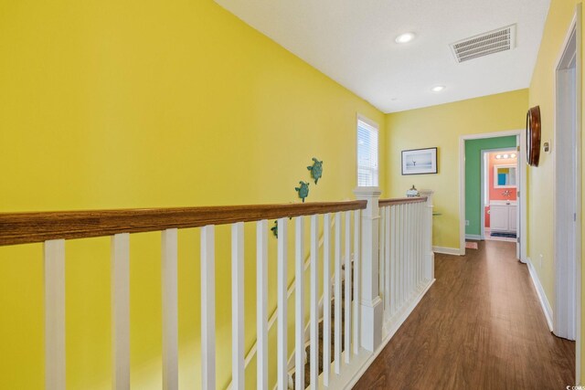 22 Ocean Blvd N, Surfside Beach, SC 29575 - hall featuring dark wood-style floors, recessed lighting, and an upstairs landing