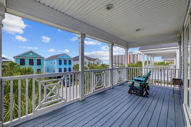 22 Ocean Blvd N, Surfside Beach, SC 29575 - wooden terrace featuring a residential view