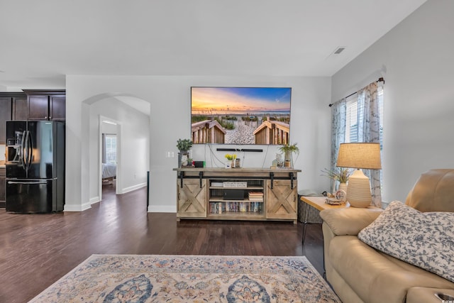 321 Sanctuary Ct, Myrtle Beach, SC 29588 - living room featuring arched walkways and wood finished floors