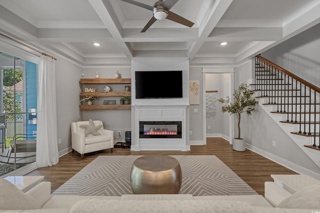 945 Waterbridge Blvd, Myrtle Beach, SC 29579 - living room featuring wood finished floors, ceiling fan, a glass covered fireplace, stairs, and beam ceiling