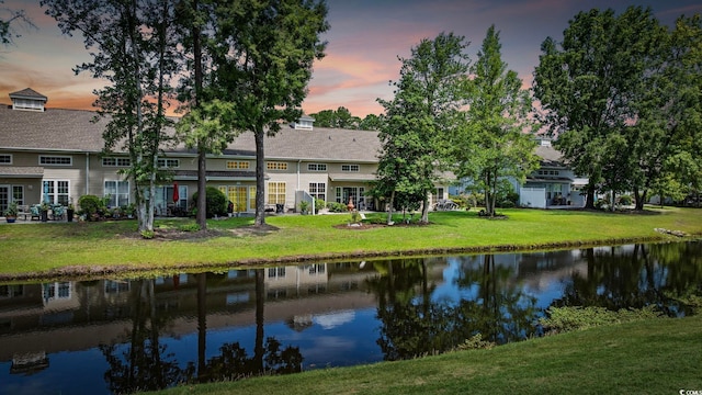 2150 Longwood Lakes Dr Unit 2150, Myrtle Beach, SC 29579 - back of property with a lawn and a water view