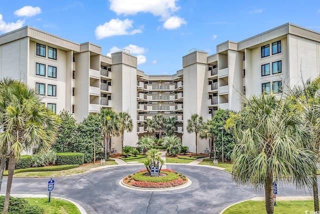741 Retreat Beach Cir Unit B-1-A, Pawleys Island, SC 29585 - view of apartment building / complex with curved driveway