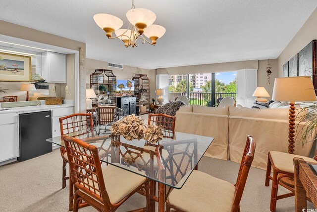 741 Retreat Beach Cir Unit B-1-A, Pawleys Island, SC 29585 - dining room featuring light carpet and a chandelier