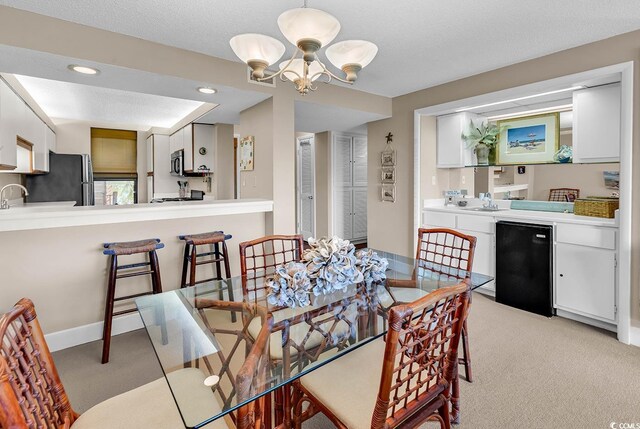 741 Retreat Beach Cir Unit B-1-A, Pawleys Island, SC 29585 - dining area featuring light carpet, a chandelier, and recessed lighting