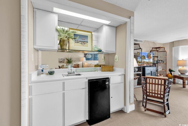 741 Retreat Beach Cir Unit B-1-A, Pawleys Island, SC 29585 - indoor wet bar featuring refrigerator and light carpet
