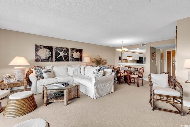 741 Retreat Beach Cir Unit B-1-A, Pawleys Island, SC 29585 - living area with a chandelier, light colored carpet, and a textured ceiling