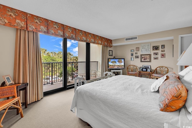 741 Retreat Beach Cir Unit B-1-A, Pawleys Island, SC 29585 - bedroom with light colored carpet and access to exterior
