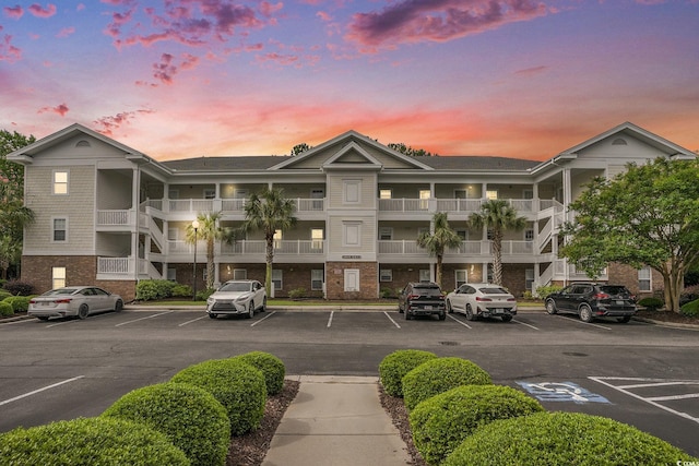 6015 Catalina Dr Unit 634, North Myrtle Beach, SC 29582 - property at dusk with uncovered parking