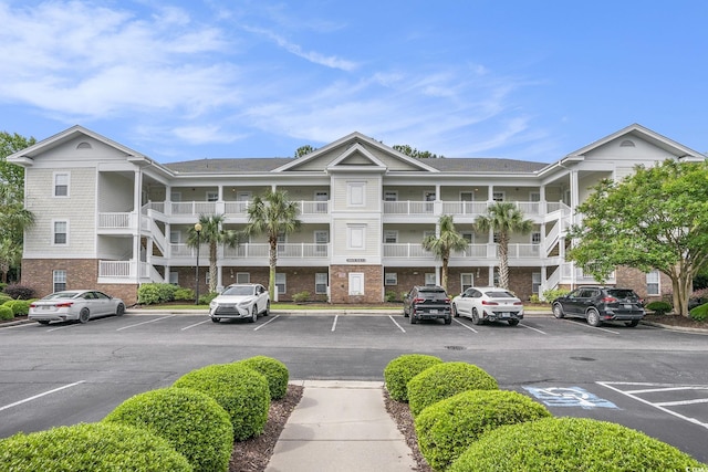 6015 Catalina Dr Unit 634, North Myrtle Beach, SC 29582 - view of apartment building / complex featuring uncovered parking