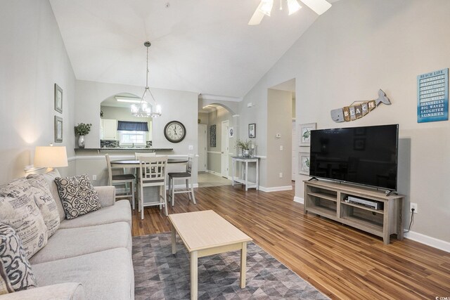 6015 Catalina Dr Unit 634, North Myrtle Beach, SC 29582 - living room featuring arched walkways, high vaulted ceiling, ceiling fan, wood finished floors, and a chandelier
