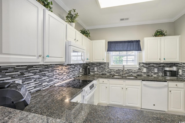 6015 Catalina Dr Unit 634, North Myrtle Beach, SC 29582 - kitchen featuring white appliances, tasteful backsplash, white cabinetry, crown molding, and dark stone counters