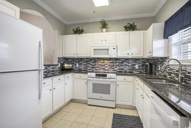 6015 Catalina Dr Unit 634, North Myrtle Beach, SC 29582 - kitchen with white appliances, white cabinets, decorative backsplash, light tile patterned floors, and crown molding