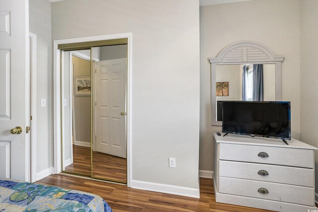 6015 Catalina Dr Unit 634, North Myrtle Beach, SC 29582 - bedroom featuring wood finished floors and baseboards