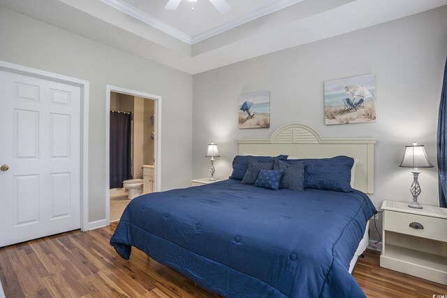 6015 Catalina Dr Unit 634, North Myrtle Beach, SC 29582 - bedroom featuring ornamental molding, wood finished floors, ensuite bath, and a ceiling fan