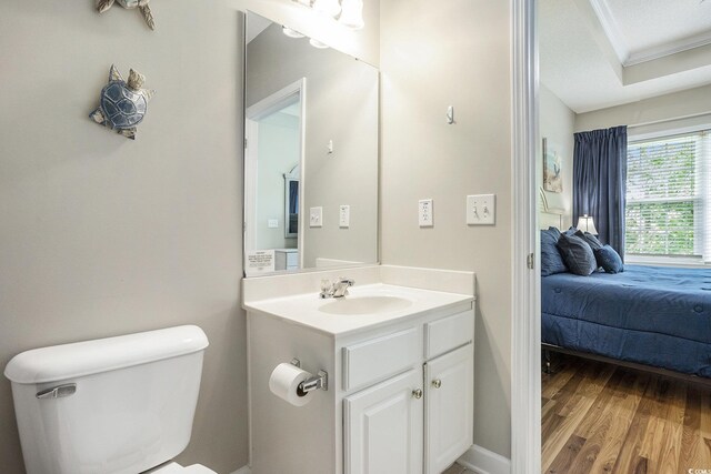 6015 Catalina Dr Unit 634, North Myrtle Beach, SC 29582 - bathroom featuring crown molding, vanity, wood finished floors, and connected bathroom