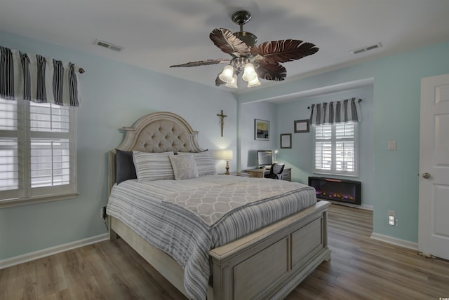 4525 Landing Rd, Little River, SC 29566 - bedroom featuring wood finished floors and ceiling fan