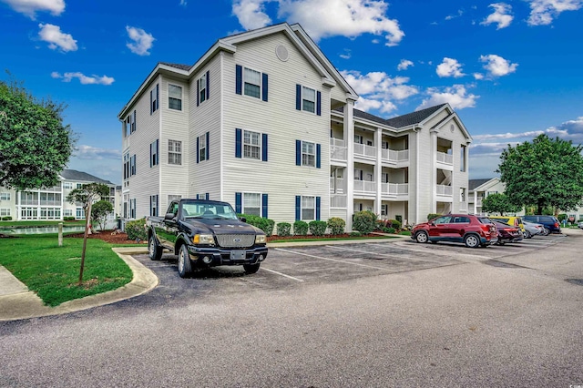 901 W Port Dr Unit 305, North Myrtle Beach, SC 29582 - view of building exterior featuring uncovered parking