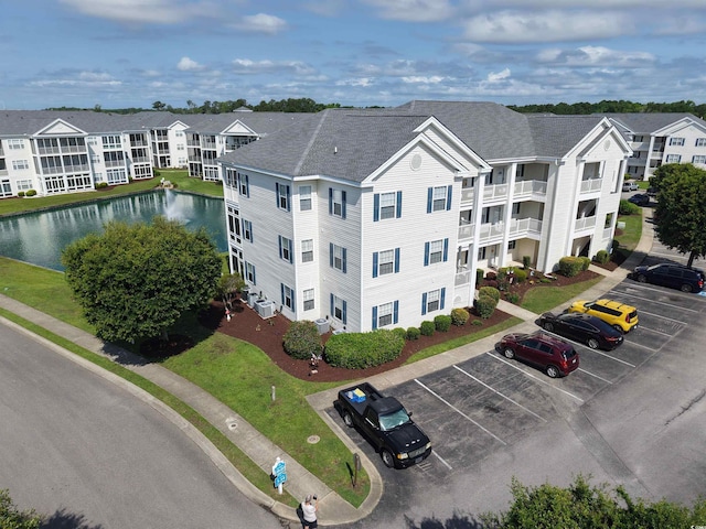 901 W Port Dr Unit 305, North Myrtle Beach, SC 29582 - view of property with uncovered parking and a water view