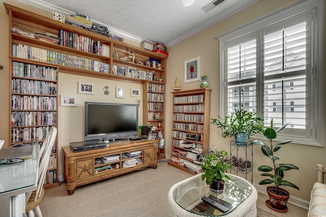 901 W Port Dr Unit 305, North Myrtle Beach, SC 29582 - living area featuring ornamental molding, light tile patterned floors, and a textured ceiling