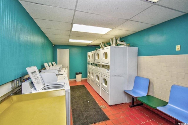 201 74th Ave N Unit 707, Myrtle Beach, SC 29572 - shared laundry room with stacked washer / drying machine, washing machine and clothes dryer, and tile patterned flooring