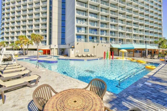 201 74th Ave N Unit 707, Myrtle Beach, SC 29572 - community pool featuring a patio area