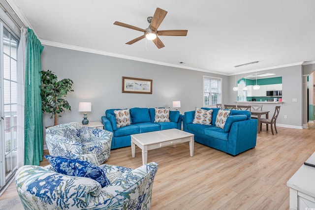 5825 Catalina Dr Unit 125, North Myrtle Beach, SC 29582 - living area with ornamental molding, light wood-type flooring, and a ceiling fan