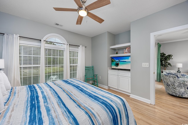5825 Catalina Dr Unit 125, North Myrtle Beach, SC 29582 - bedroom with light wood-style flooring and ceiling fan