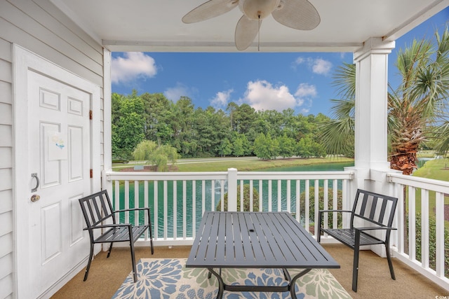 5825 Catalina Dr Unit 125, North Myrtle Beach, SC 29582 - balcony featuring ceiling fan, a water view, and view of scattered trees