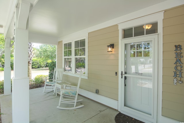 4901 N Market St, North Myrtle Beach, SC 29582 - doorway to property with a porch