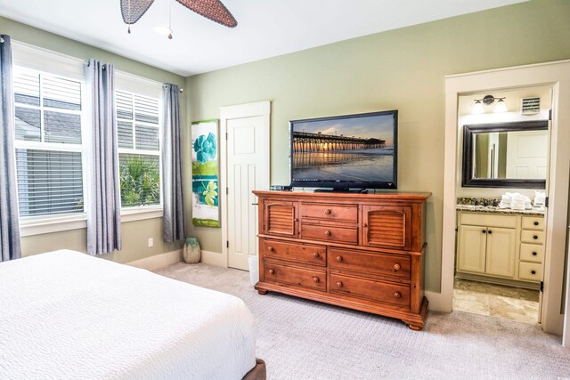 4901 N Market St, North Myrtle Beach, SC 29582 - bedroom featuring light colored carpet, connected bathroom, and ceiling fan