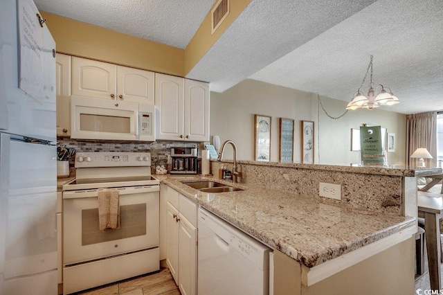 9400 Shore Dr Unit 617, Myrtle Beach, SC 29572 - kitchen with white appliances, a peninsula, a textured ceiling, decorative backsplash, and white cabinets