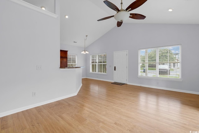 1636 Stuart Square Cir, Myrtle Beach, SC 29577 - unfurnished living room featuring ceiling fan, a chandelier, high vaulted ceiling, and light wood-style floors