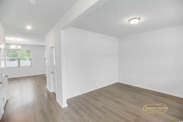 547 Pacific Commons Dr, Surfside Beach, SC 29575 - spare room with a chandelier, wood finished floors, and a smoke detector
