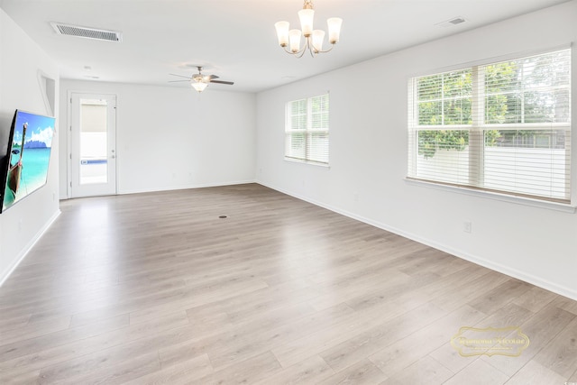547 Pacific Commons Dr, Surfside Beach, SC 29575 - unfurnished room featuring a ceiling fan, a chandelier, and light wood-style floors