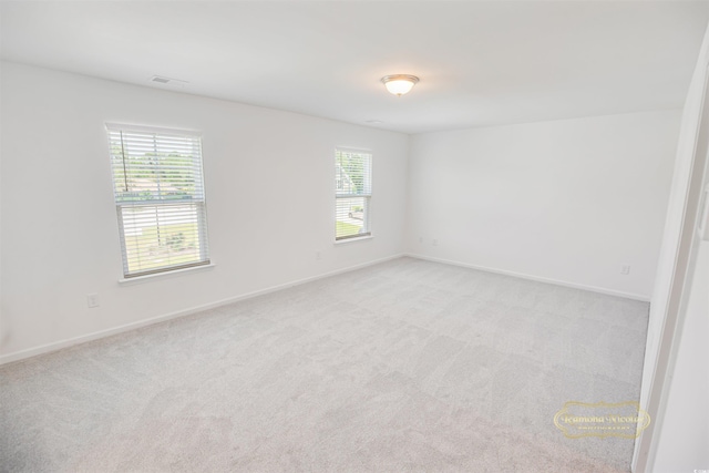 547 Pacific Commons Dr, Surfside Beach, SC 29575 - empty room with plenty of natural light and light colored carpet