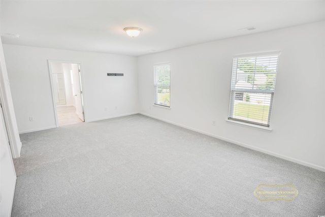 547 Pacific Commons Dr, Surfside Beach, SC 29575 - unfurnished room featuring healthy amount of natural light and light carpet