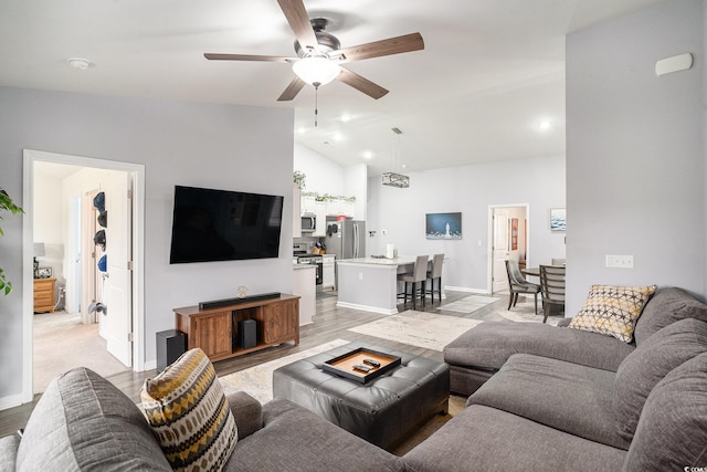 1807 Berkley Village Loop, Myrtle Beach, SC 29579 - living area featuring a ceiling fan, vaulted ceiling, and light wood-style floors