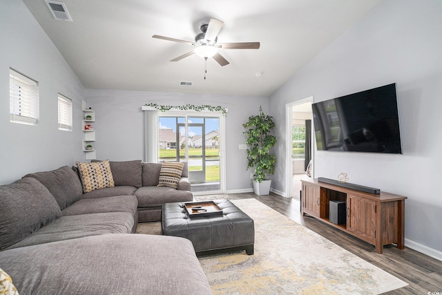 1807 Berkley Village Loop, Myrtle Beach, SC 29579 - living room featuring vaulted ceiling, a ceiling fan, healthy amount of natural light, and wood finished floors