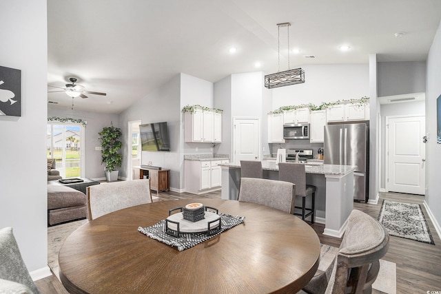 1807 Berkley Village Loop, Myrtle Beach, SC 29579 - dining area featuring wood finished floors, a ceiling fan, recessed lighting, and high vaulted ceiling