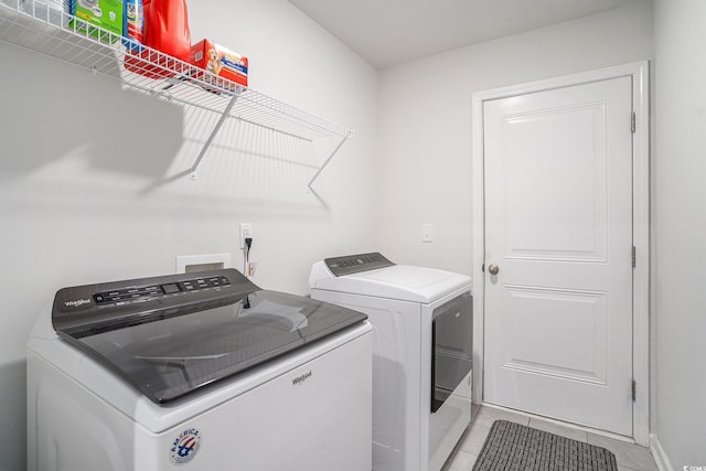 1807 Berkley Village Loop, Myrtle Beach, SC 29579 - laundry room with washing machine and clothes dryer and light tile patterned floors
