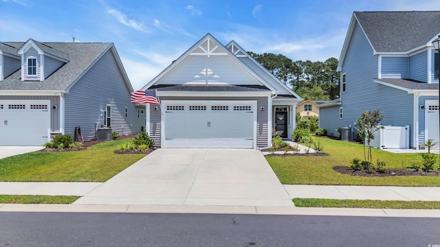598 Cascade Loop, Little River, SC 29566 - craftsman inspired home with a front lawn, driveway, an attached garage, and roof with shingles