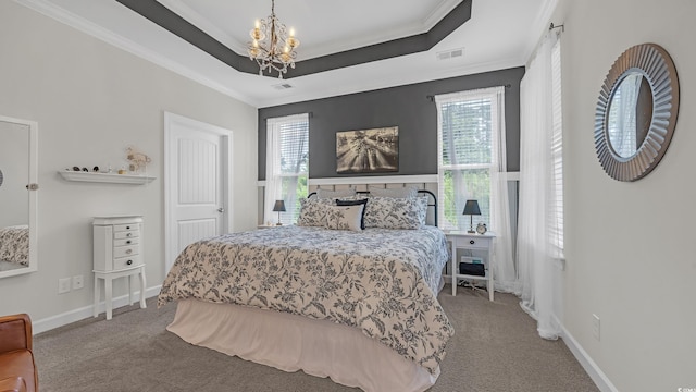 598 Cascade Loop, Little River, SC 29566 - carpeted bedroom with a chandelier, ornamental molding, multiple windows, and a raised ceiling