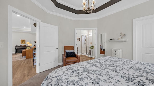 598 Cascade Loop, Little River, SC 29566 - bedroom featuring a tray ceiling, ornamental molding, a chandelier, and wood finished floors