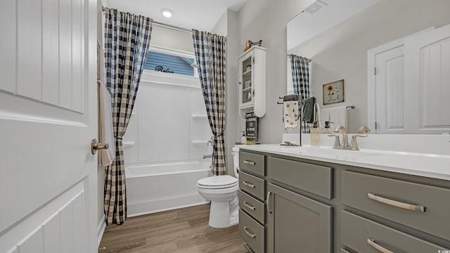 598 Cascade Loop, Little River, SC 29566 - bathroom with vanity, shower / bathtub combination with curtain, and wood finished floors