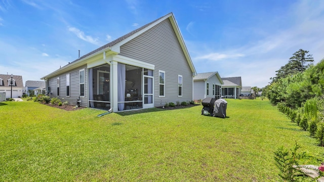 598 Cascade Loop, Little River, SC 29566 - back of property featuring a yard and a sunroom