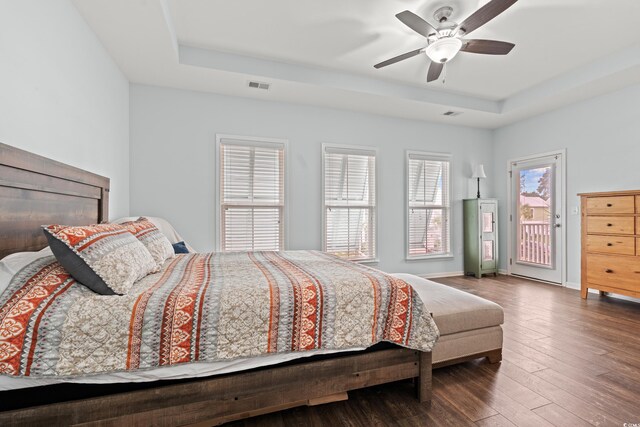 540 Chanted Dr, Murrells Inlet, SC 29576 - bedroom featuring a raised ceiling, access to outside, multiple windows, and wood-type flooring