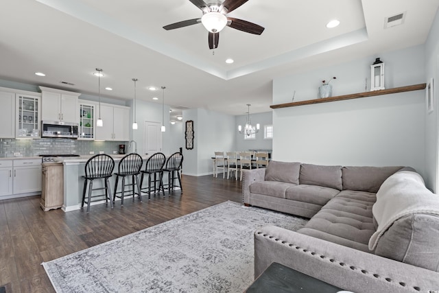 540 Chanted Dr, Murrells Inlet, SC 29576 - living area with dark wood finished floors, recessed lighting, a chandelier, ceiling fan, and a raised ceiling