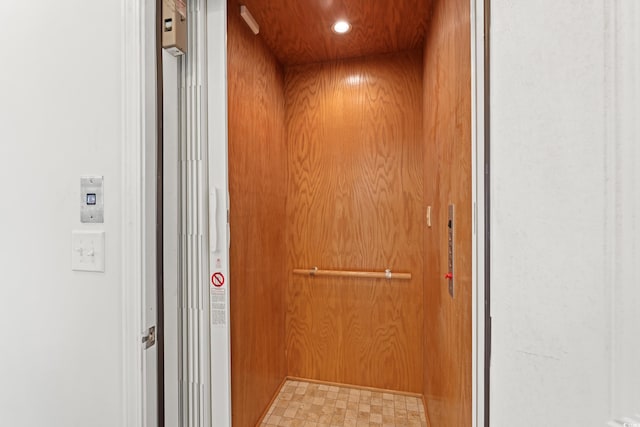 540 Chanted Dr, Murrells Inlet, SC 29576 - elevator featuring wooden walls and tile patterned floors