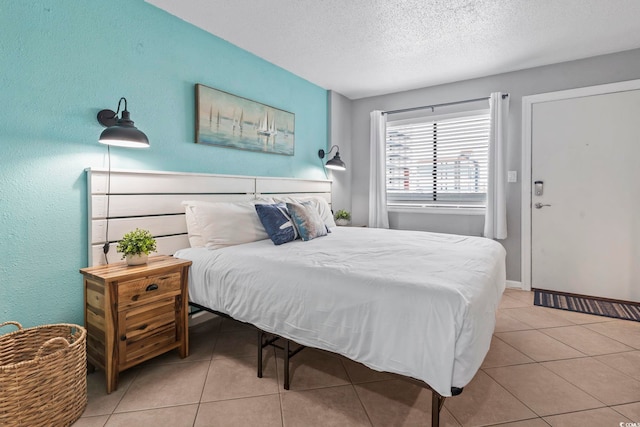 2001 S Ocean Blvd Unit 1408, Myrtle Beach, SC 29577 - bedroom featuring tile patterned floors and a textured ceiling