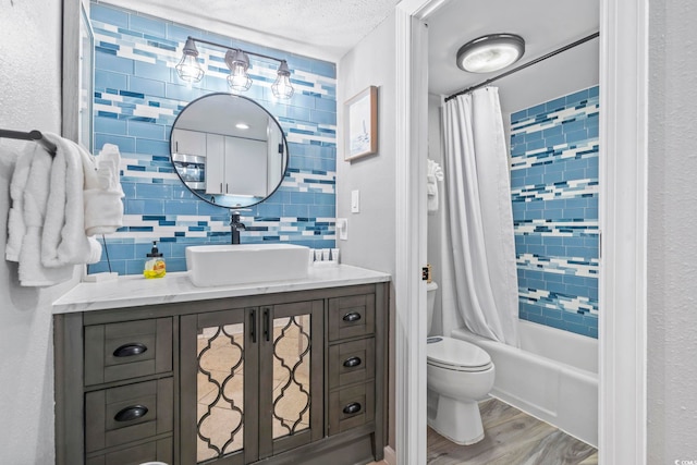 2001 S Ocean Blvd Unit 1408, Myrtle Beach, SC 29577 - full bathroom with vanity, shower / bathtub combination with curtain, wood finished floors, and a textured ceiling